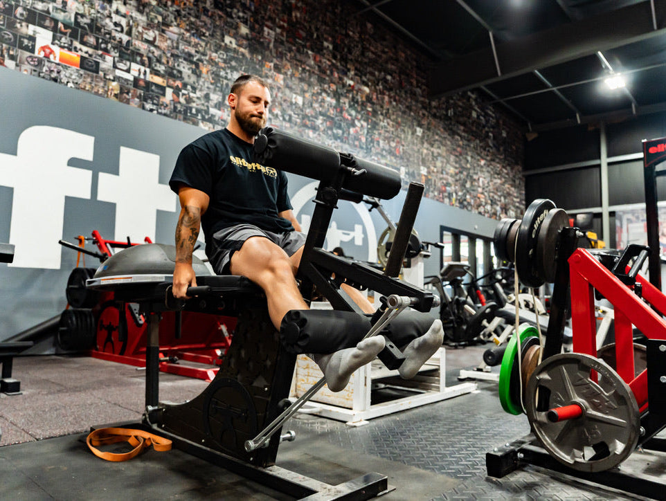 Leg extension leg curl machine