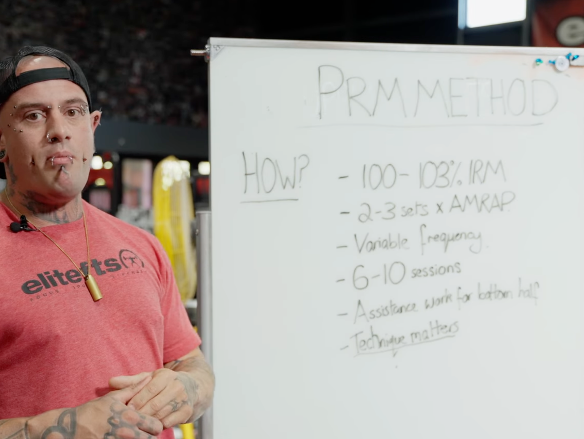 Tom next to a white board