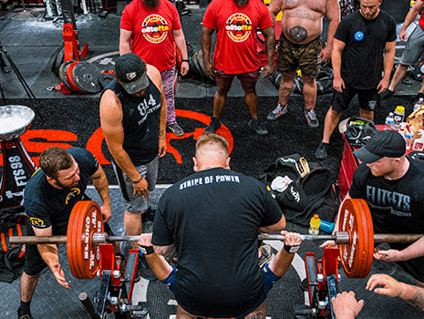 ariel shot of lifters spotting a guy while benchingYear Plan Ashley Jones