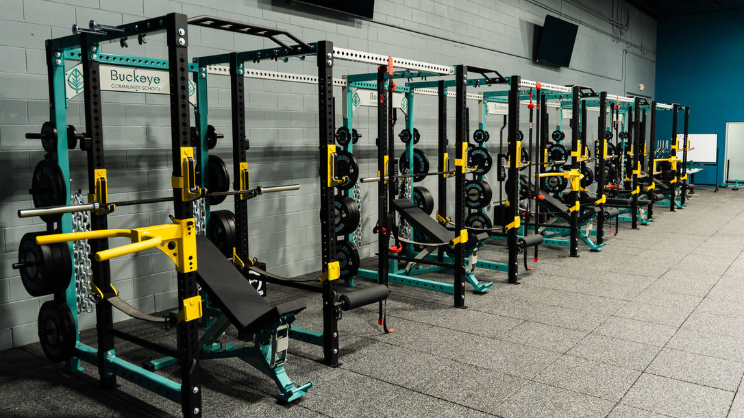 Buckeye Community School custom elitefts power racks with teal, gray, and yellow rack details