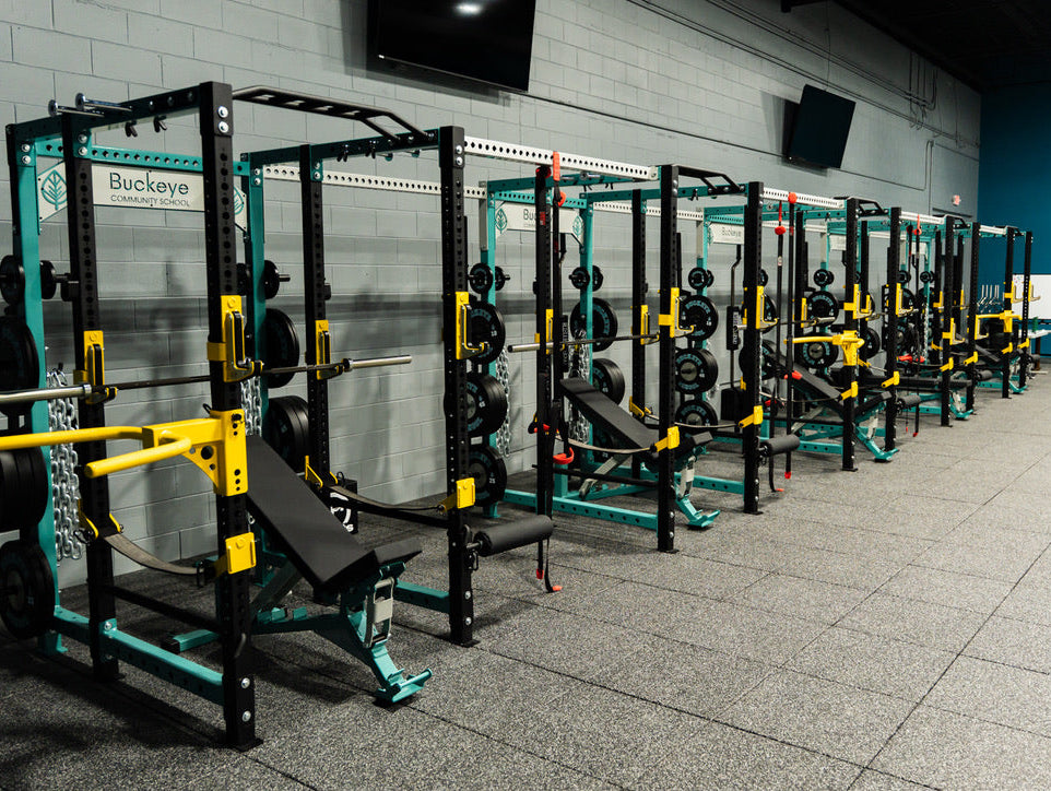 Buckeye Community School custom elitefts power racks with teal, gray, and yellow rack details