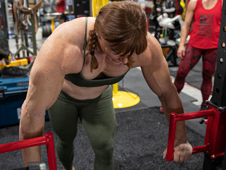lifter getting ready for overhead pressez loaders shop