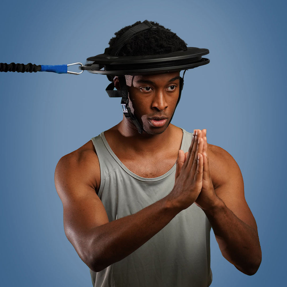 Man wearing a weighted headband against a blue background