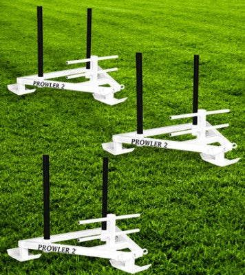 Three white athletic training hurdles labeled 'Prowler 2' on a grass field.