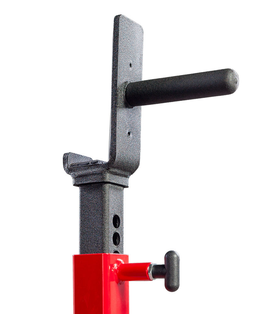 Close-up of a mechanical component with a red base and black handle on a white background