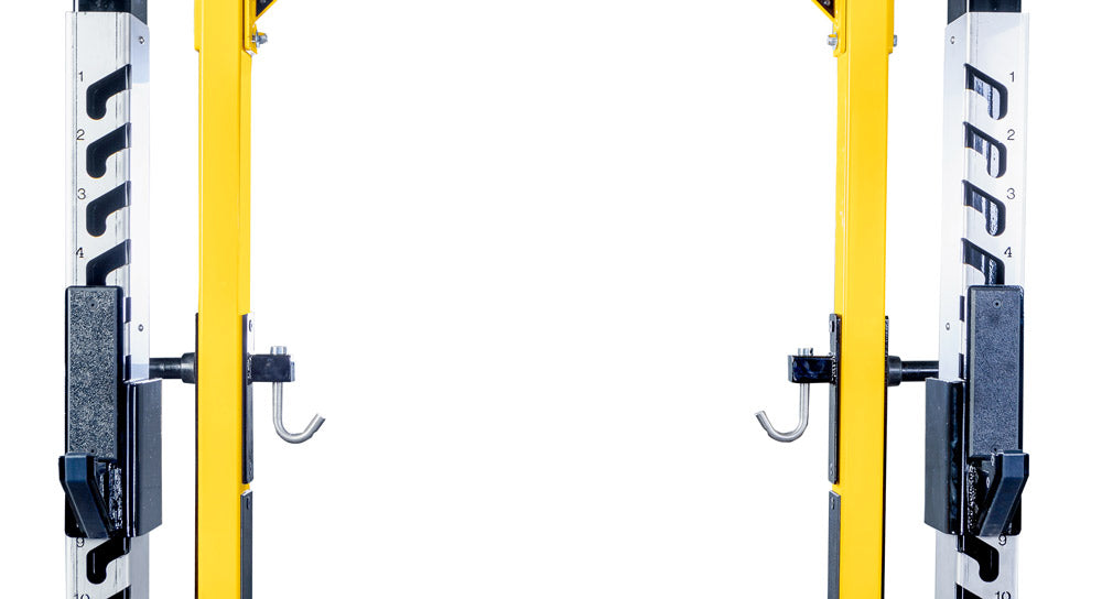 Yellow and black squat rack on a white background