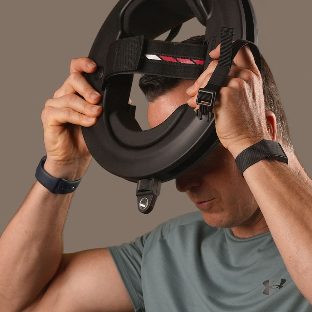 Person Adjusting the Iron Neck Pro