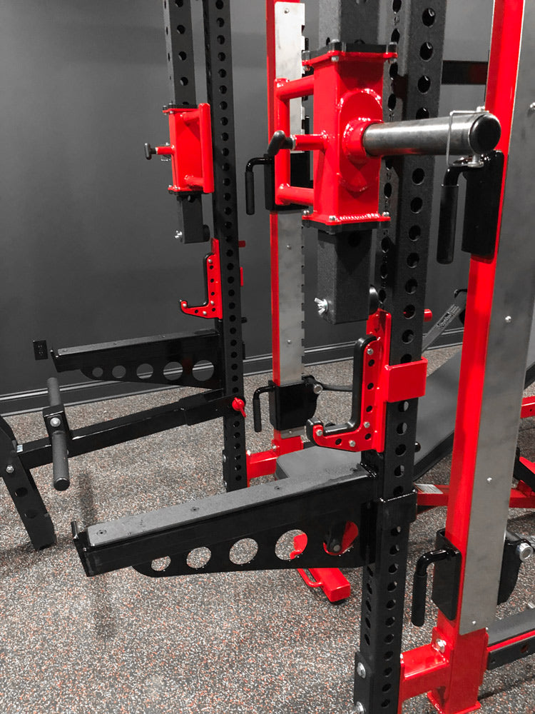 Red and black weightlifting rack in a gym setting