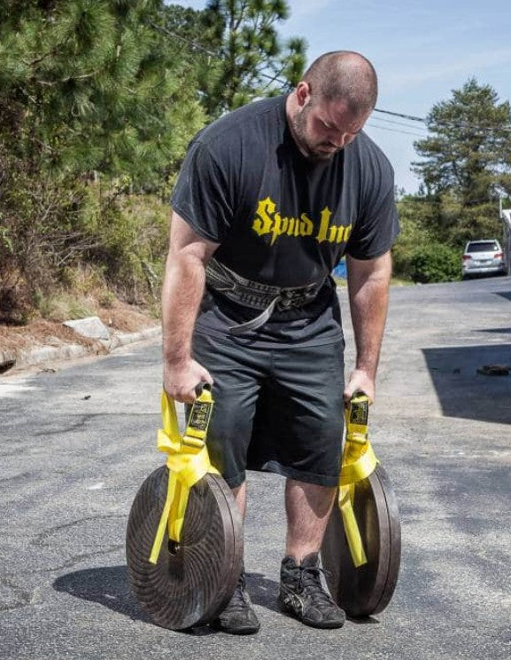 picture of a person using the Spud Traveling Farmers Walks straps