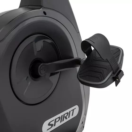 Close-up of a black exercise bike with 'Spirit' branding on a white background