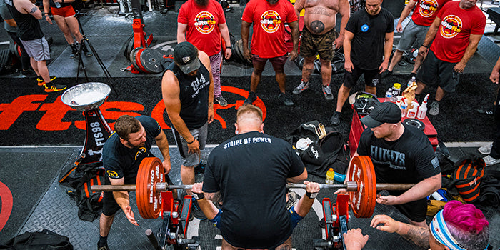 ariel shot of lifters spotting a guy while benchingYear Plan Ashley Jones