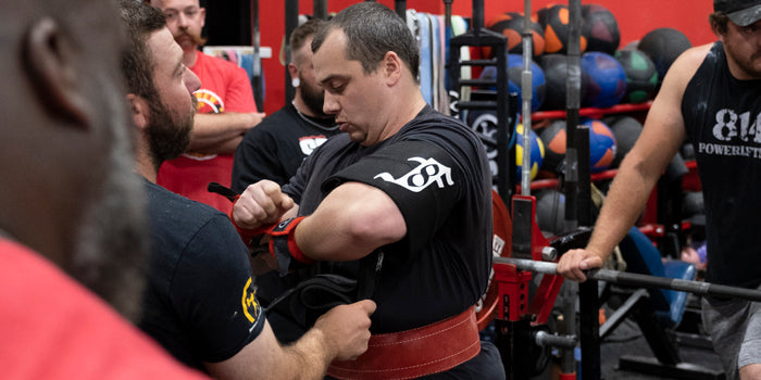 man putting wraps on wrists