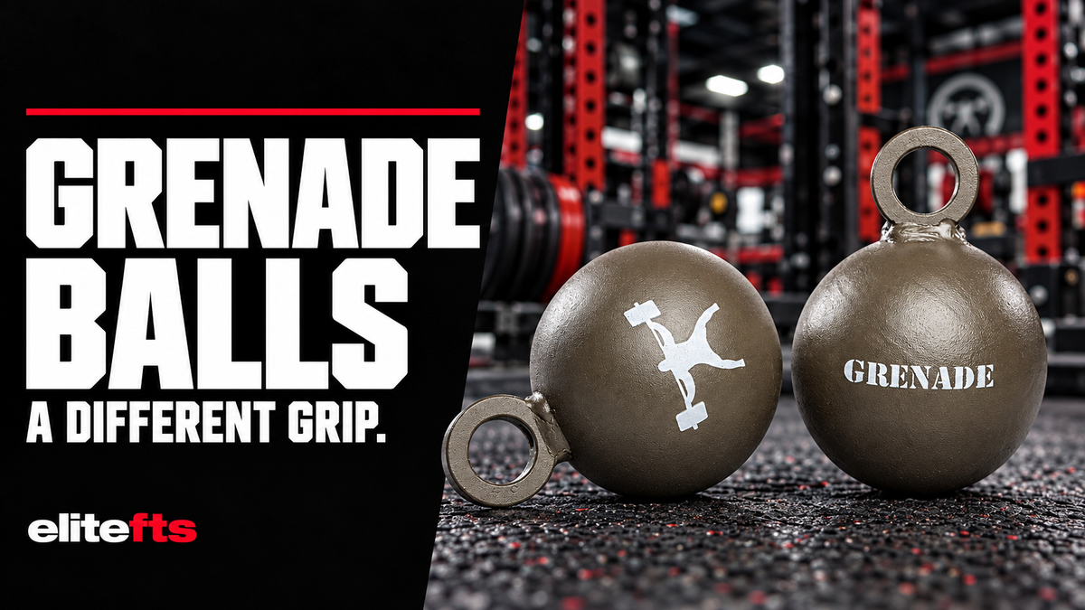 Two olive-drab elitefts Grenade Balls with circular attachment eyes in a red-and-black gym, beside the words Grenade Balls: A Different Grip.