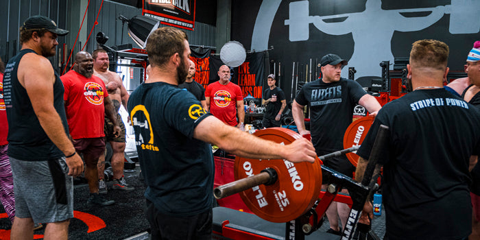 guys benching in gym