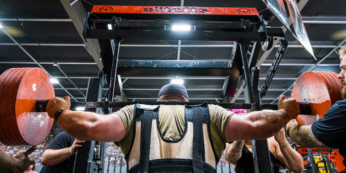 rear view of guy squatting in monolift