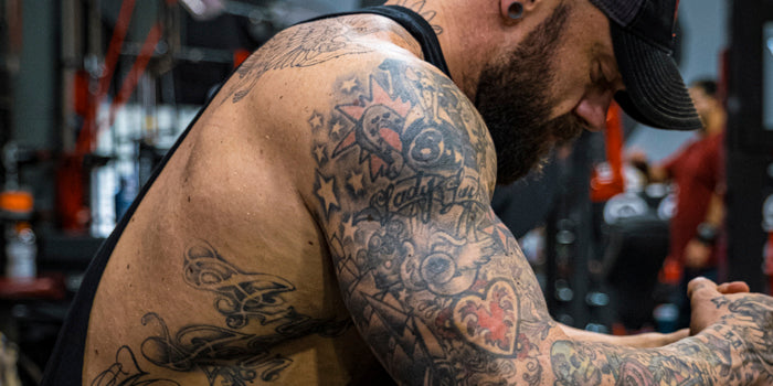 bodybuilder training with tattoos