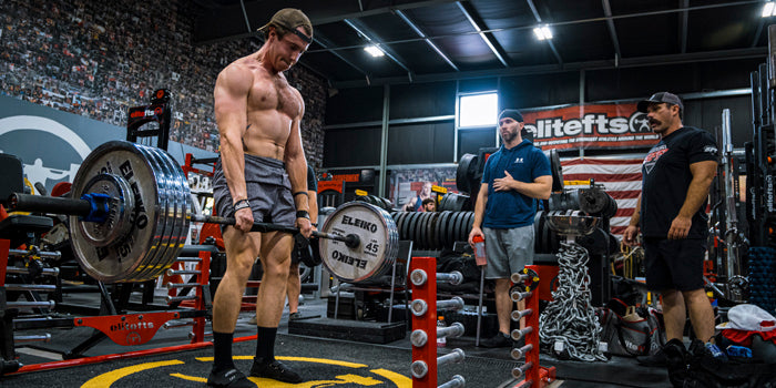 shirtless man deadlifting in gym