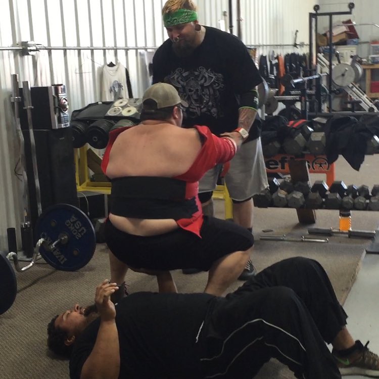 Nate anchors his hand in while benching Walter for charity video