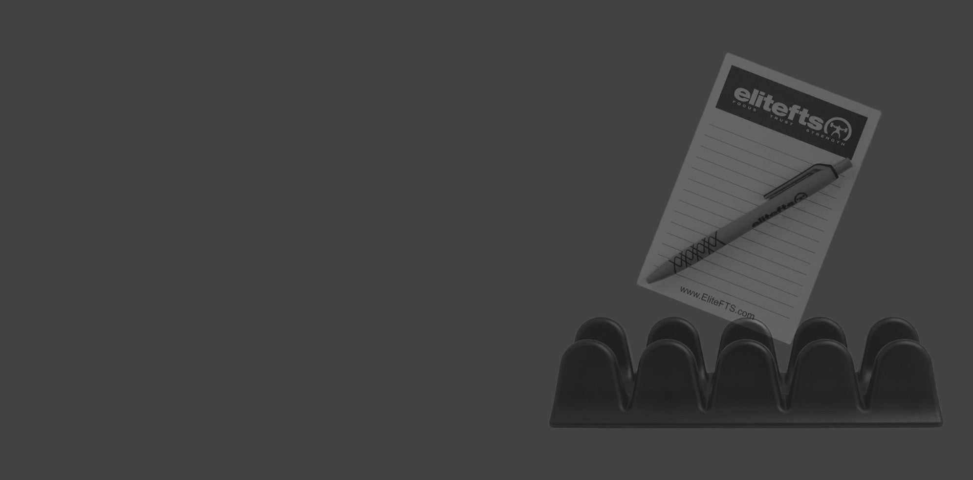 Elitefts pad of paper and pen on a stand