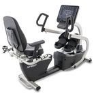 Recumbent exercise bike with digital display on a white background