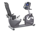 Recumbent bike with digital display on a white background