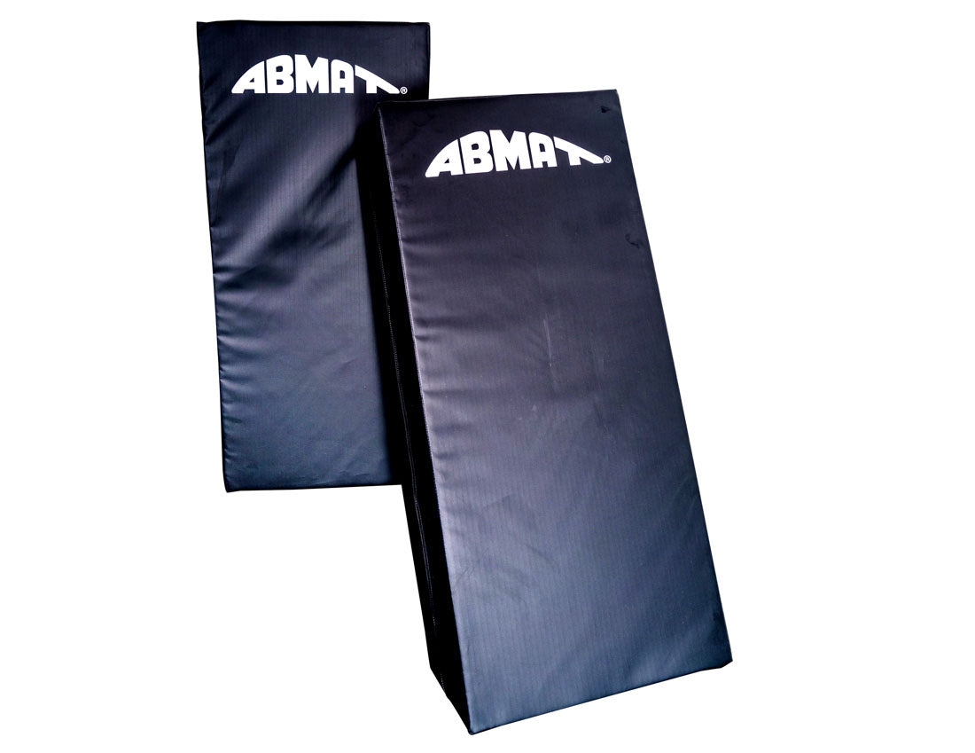 Two black ABMA mats on a white background