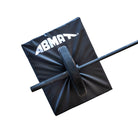 Black ABMA training mat with a barbell on a white background