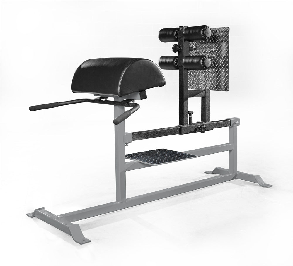 Gym machine with black padding and metal frame on a white background