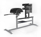 Gym machine with black padding and metal frame on a white background