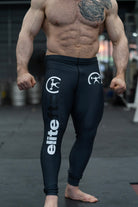 someone wearing a pair of dark gray compression pants with decals on various parts of the product
