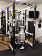 Elitefts 3X3 Basic Collegiate Power Rack located in a workout space