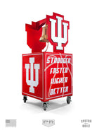 Red decorative item with 'IU' logo and bell on a white background