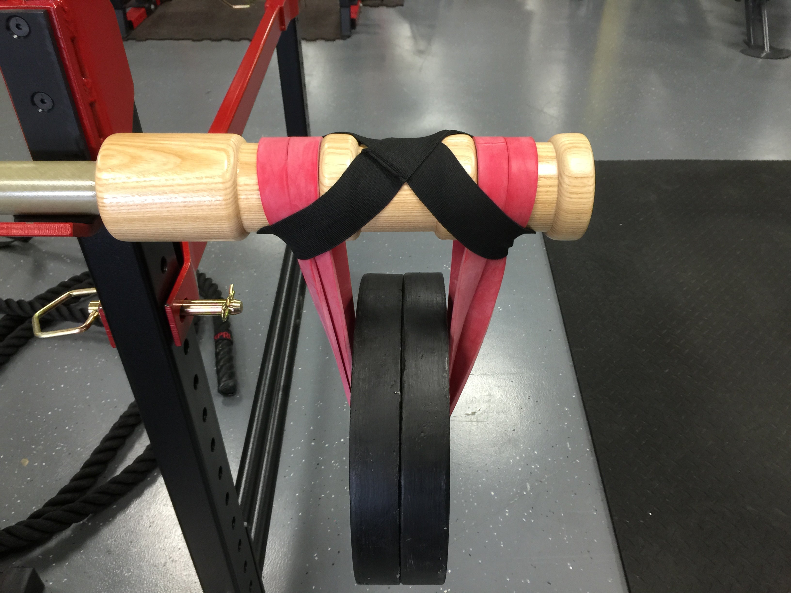 BANDBELL BANDLOCKS on bamboo bar holding bands and weight in place