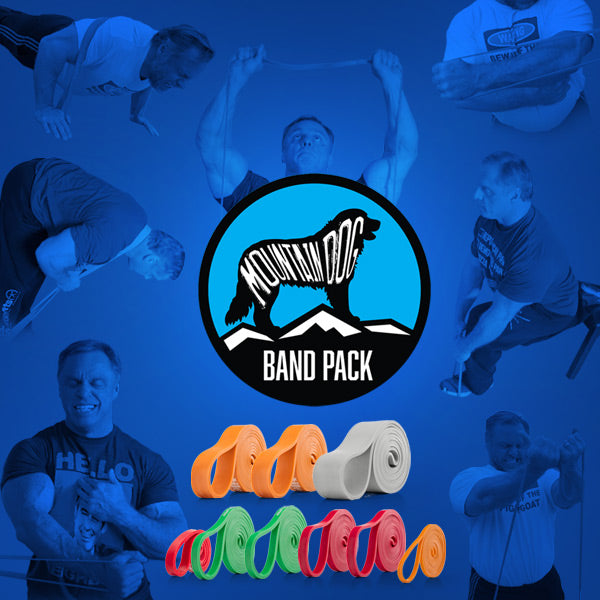 A promotional graphic for Mountain Dog Band Pack featuring a central circular logo with a mountain and dog silhouette, surrounded by faded photos of men using resistance bands. Below the logo are several rolls of bands in orange, white, green, red, and pink on a blue background.