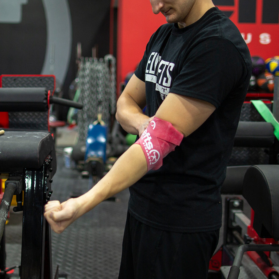 picture of someone using compression floss on the elbow
