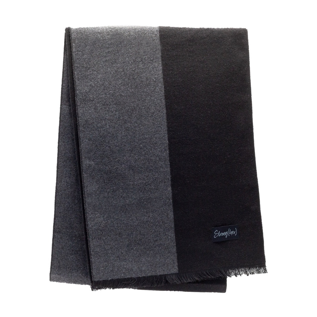 Black and gray striped scarf with a brand logo on a white background