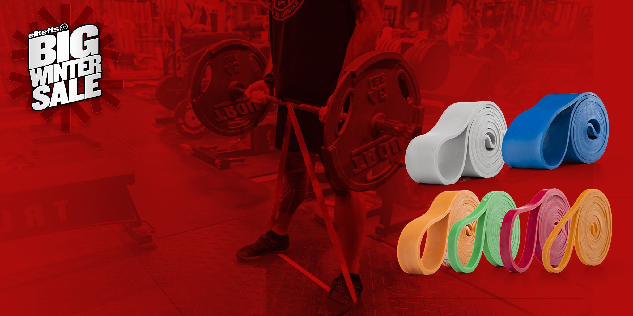 Colorful resistance bands on a red background with a weight rack and 'Big Winter Sale' text.
