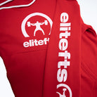 the front of the red sweat shirt with the brand decals on the chest and sleeve areas