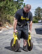 picture of a person using the Spud Traveling Farmers Walks straps