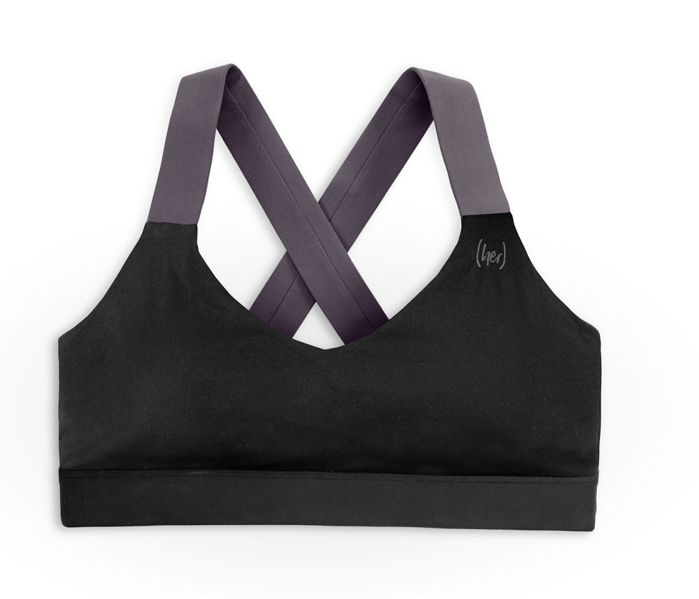 Black sports bra with straps on a white background