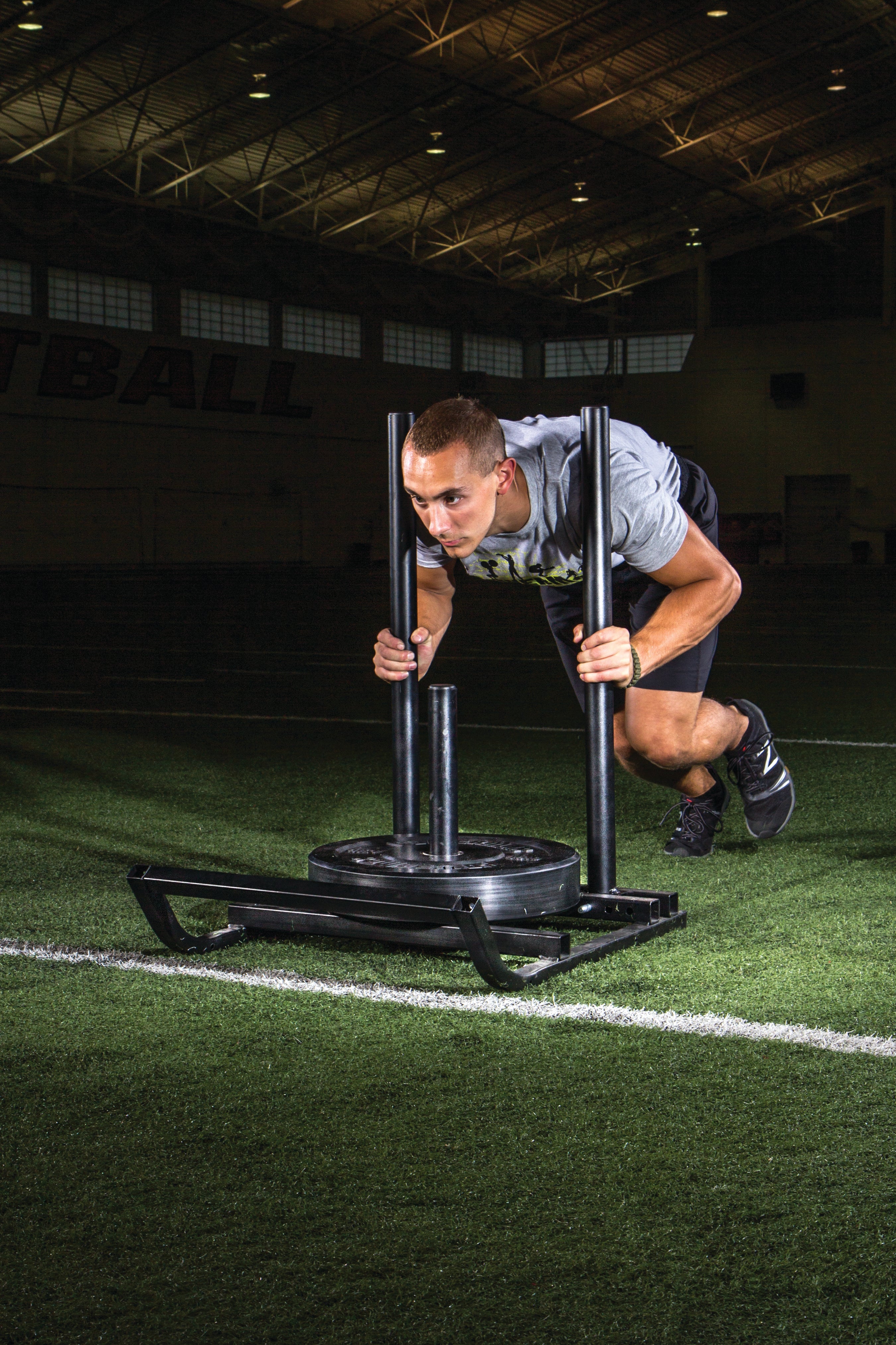 Person using a sports training device on a grass field