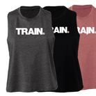 three sleeveless woman's tank tops, one black, one platinum grey, and one mauve, with the Train decal on the front