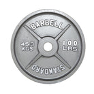 Weight plate with 'Barbell Standard' branding on a white background