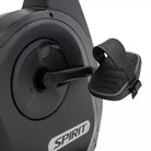 Close-up of a black exercise bike with 'Spirit' branding on a white background