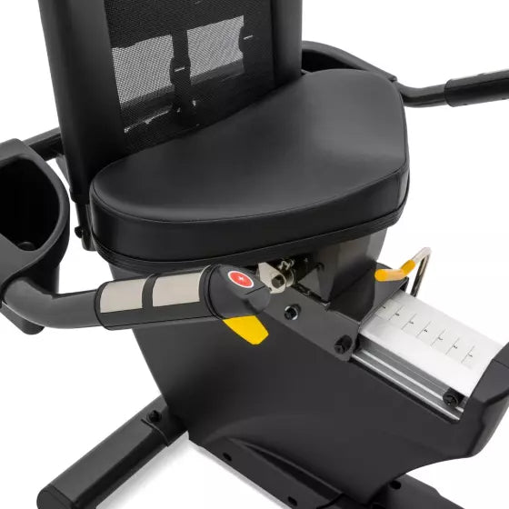 Close-up of a black exercise bike with a seat and handlebars on a white background