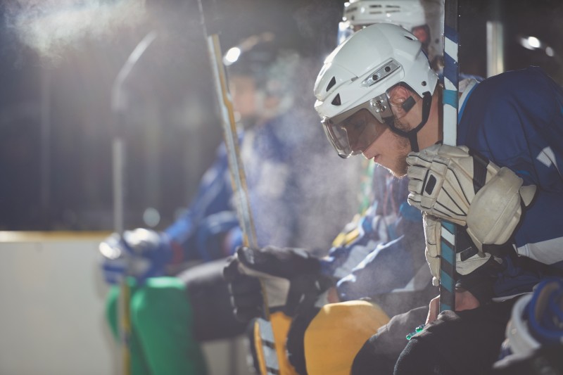 ice hockey players on bench